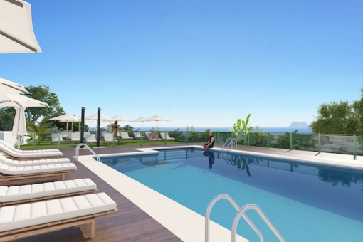 Well-maintained pool area with sea views