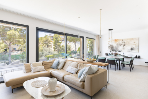 Bright living area with floor to ceiling windows