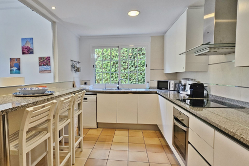 Kitchen with opening to the living area