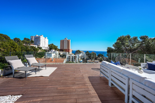 Spacious rooftop terrace with sea views
