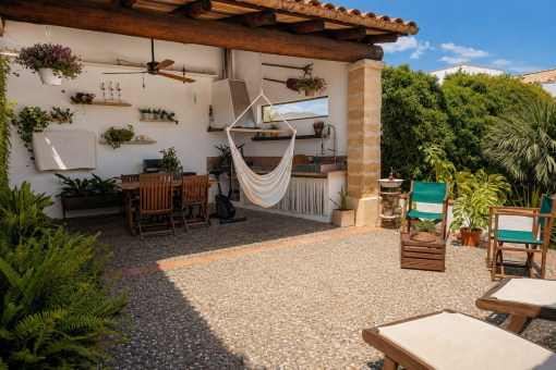 Mediterranean terrace with covered seating area 