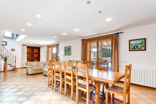 Open living and dining area with terrace access