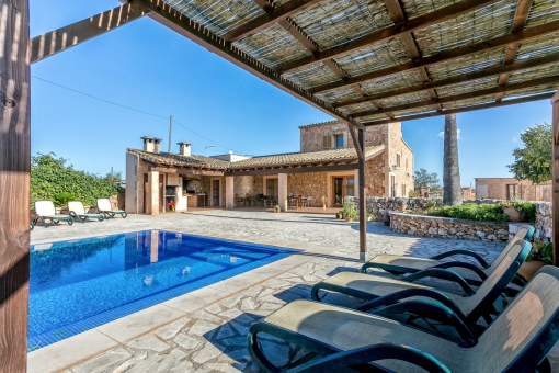 Covered chillout area next to the pool