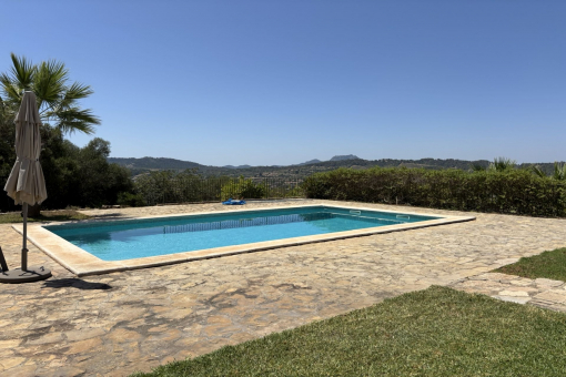 Pool area with sun terraces and wide views