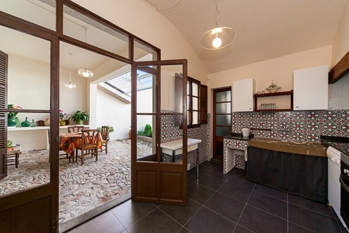 Traditional kitchen with access to the patio