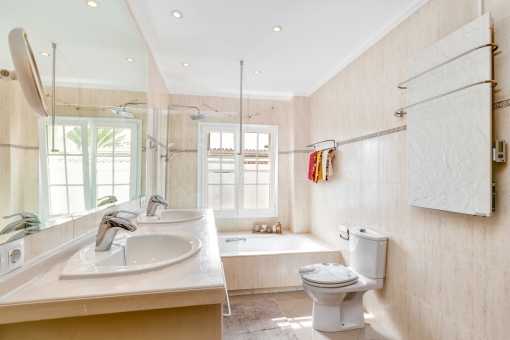 Bathroom with bathtub and natural light