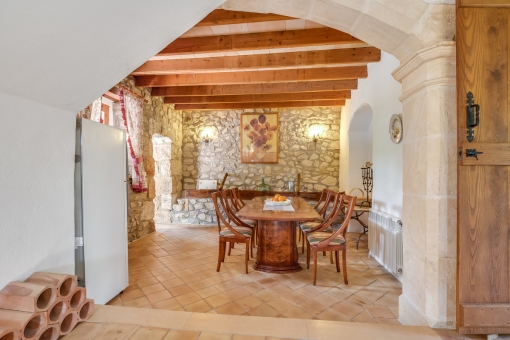 Authentic dining area with natural stone wall