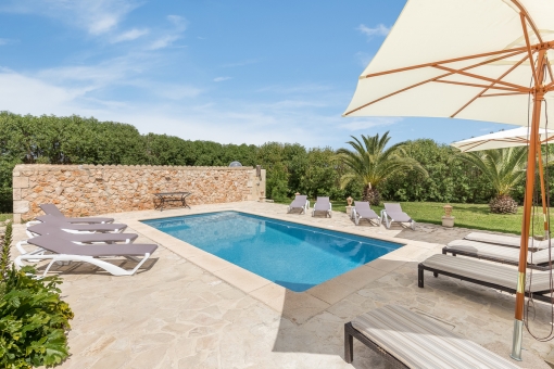 The pool area invites to relax during summer days