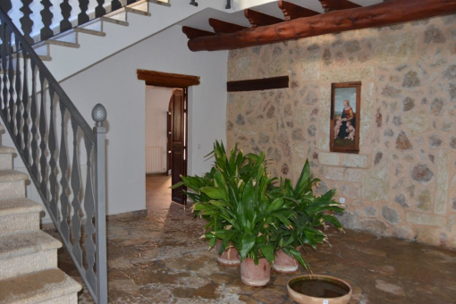 Entrance hall with stone wall