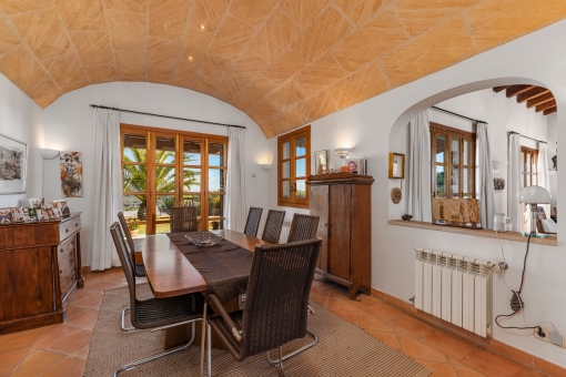 Dining area with vaulted stone ceiling