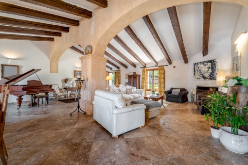 Large living area with stone arch