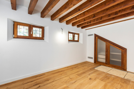 Bedroom with wooden ceiling beams