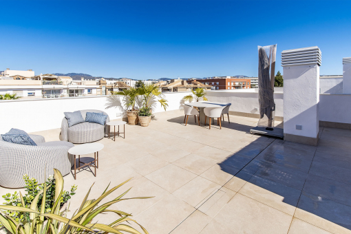 Spacious rooftop terrace with city and sea views
