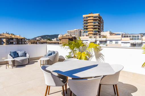 Spacious rooftop terrace with city and sea views