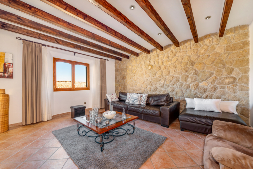 Living area with beautiful stone wall
