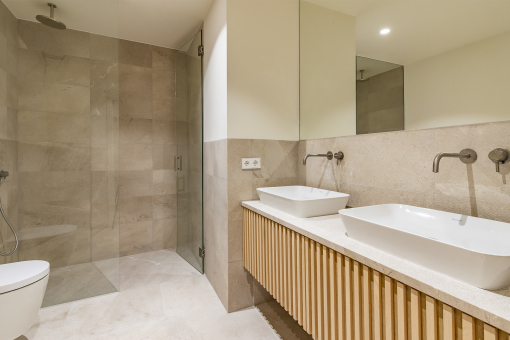 One of two modern bathrooms with shower
