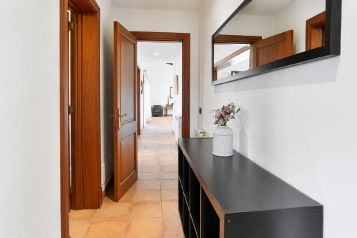 Hallway with wooden doors and console table