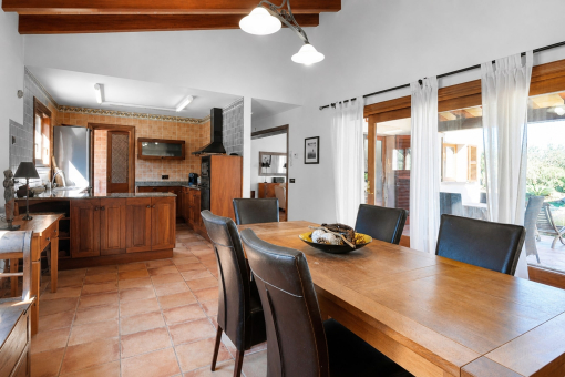 Dining area with kitchen and patio access