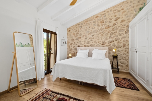 Double bedroom with authentic stone wall
