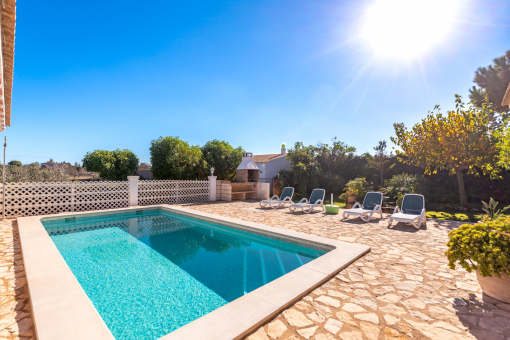 Pool surrounded by natural stone terrace