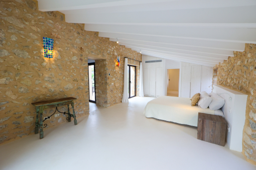 Natrual stone walls in one of the bedrooms