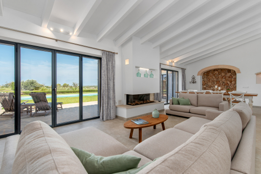 Open living and dining area with fireplace