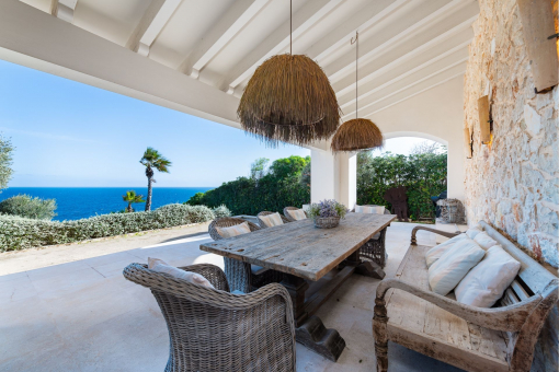 Covered terrace with dining area and stunning views