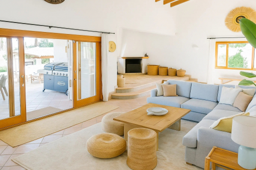 Modern living room with fireplace nook and terrace access