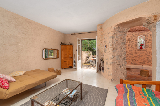 Living area with tower room and access to outdoor space