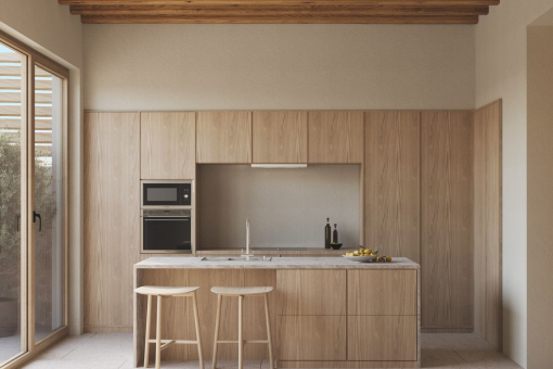 Bright designer kitchen with natural materials and patio access