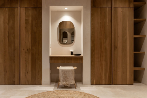 Dressing area with natural wood and architectural lines