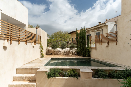 Peaceful Mediterranean patio with private pool and curated planting