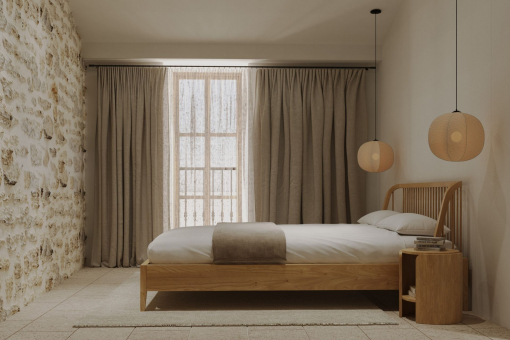 Guest bedroom with stone wall and warm lighting
