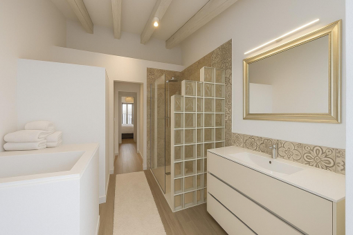 Stylish bathroom with walk-in shower and designer tiles