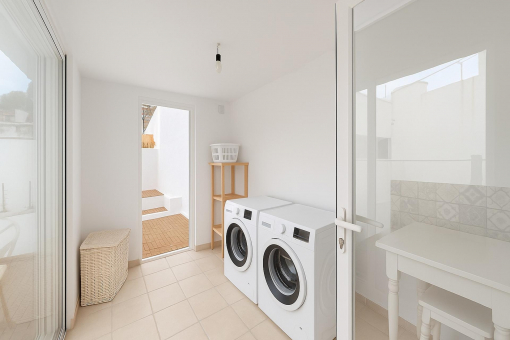 Functional laundry room with outdoor access