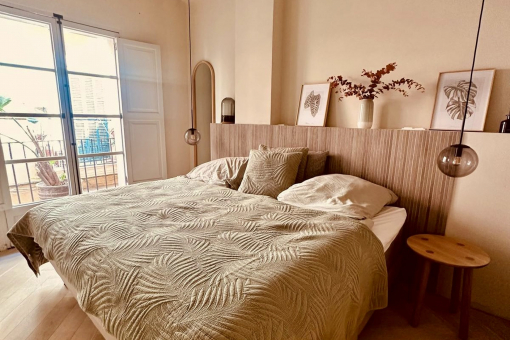 Master bedroom with original ceiling beams