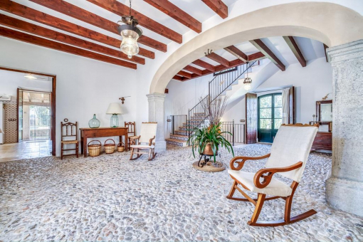 Traditional entrance area with arch and natural stone floor