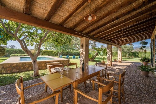 Covered veranda with outdoor dining table
