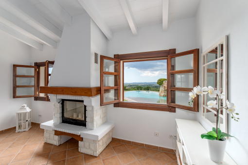 Dining area with chimney and views