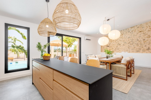 Open kitchen and dining space with pool access