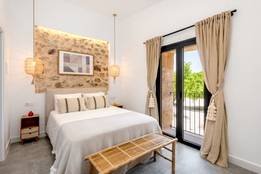 Cozy bedroom with stone wall 