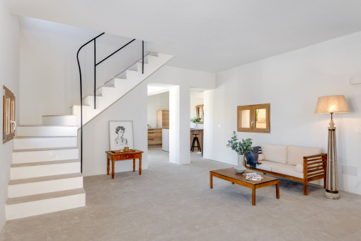 Open-plan living area with the kitchen in the background