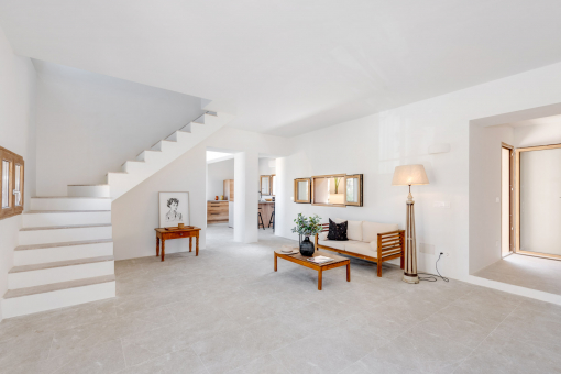 Open-plan living area with the kitchen in the background