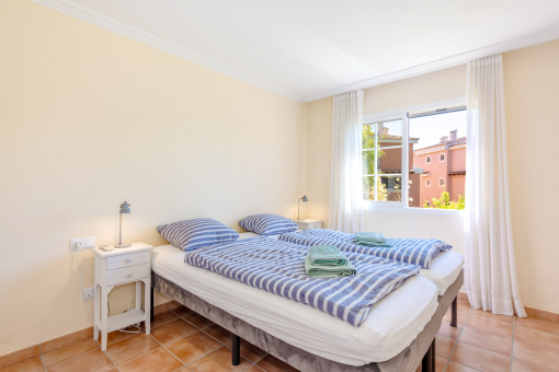 One of the two bright bedrooms