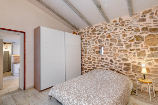 Spacious natural-stone bedroom