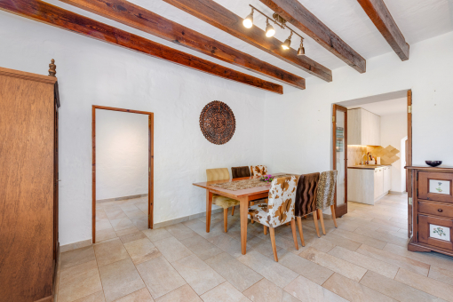 Dining area with exposed wooden beams