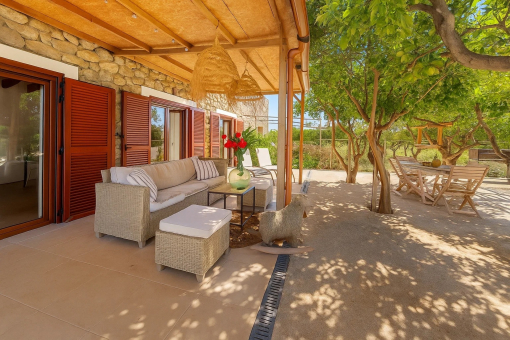 Covered terrace with seating areas