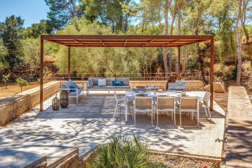 Covered dining area with view of the pool and surroundings