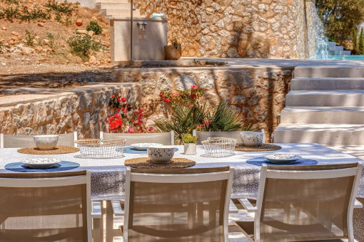 Covered dining area with view of the pool and surroundings