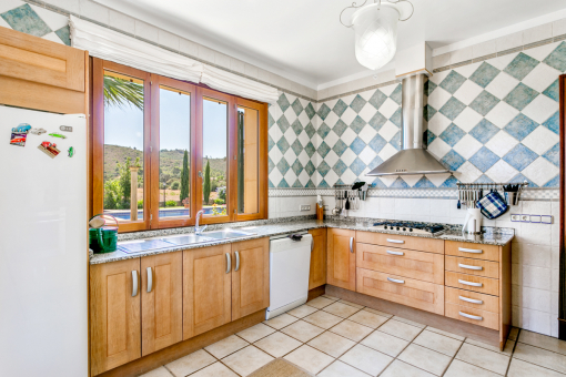 Spacious kitchen with views to the pool